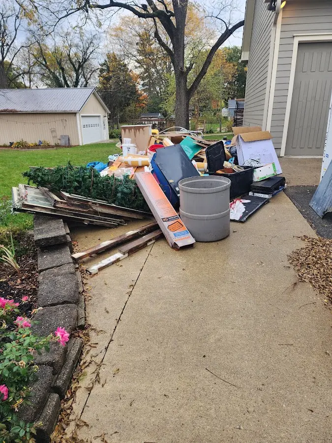 Dumpster being loaded with debris for 3 Yard Dumpster Rental in West Deer